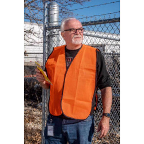 Man wearing a C. H. Hanson adult size bright orange mesh safety vest