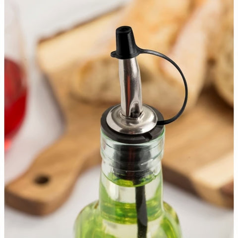 Vented Bottle Pourer w/Cap H599PTC2 displayed on glass
