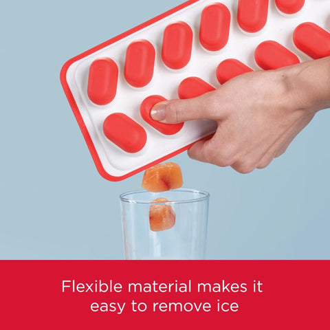 Red/White Ice Tray 2122588 with ice falling from it into a glass