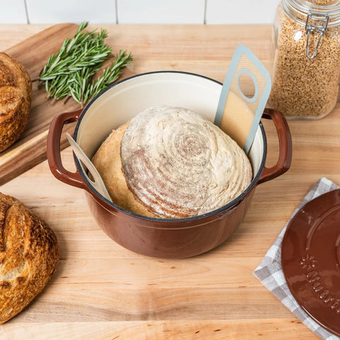  Silicone Sourdough Bread Sling 527020 with baked bread loaf on top of it