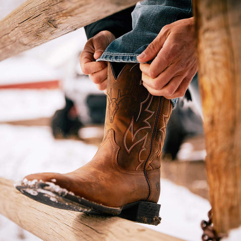 Putting on a Ariat men's Sport Outdoor Cowboy Boot 10038330