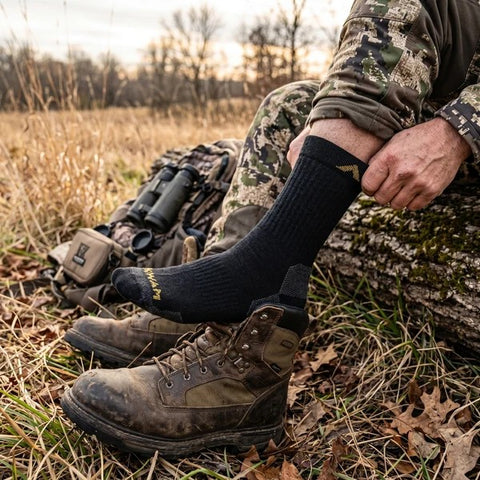 Hunter putting on a Wigwam Alpaca Midweight Boot Sock