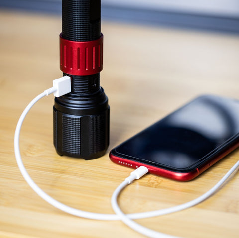 Dorcy Ultra HD Rechargeable Flashlight being used as a power bank