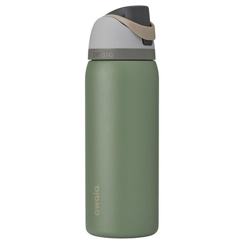 Owala FreeSip 24 oz water bottle in green house
