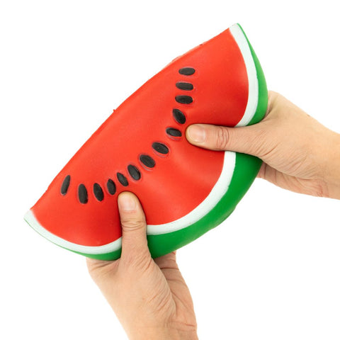 Squeezing the The Big Squij Watermelon squishy toy
