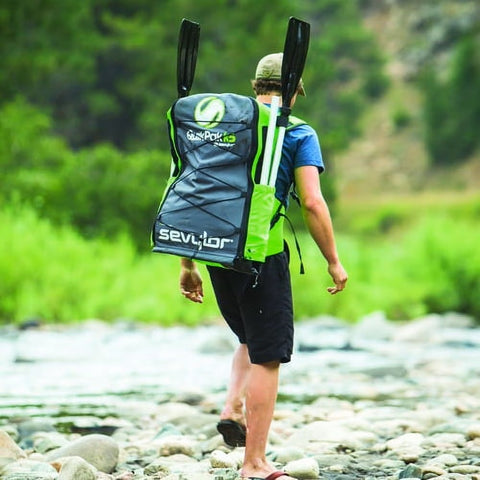 Man carrying Coleman Sevylor K5 QuikPak Inflatable Kayak in backpack