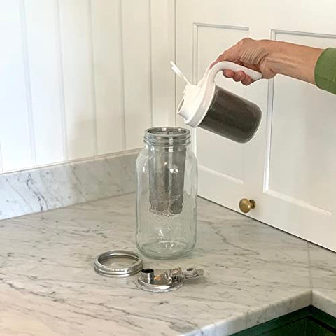 Cold Brew Coffee Maker 82749 grounds being poured in strainer