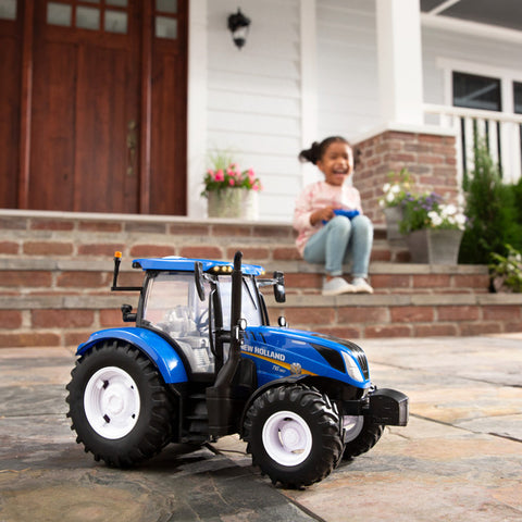 girl playing with tractor